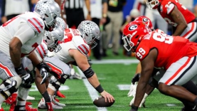 The Ohio State Buckeyes offense lines up against the Georgia Bulldogs defense during the third quarter Saturday in Atlanta.
