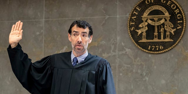 Fulton County Superior Court Judge Robert McBurney swears in potential jurors during proceedings to seat a special purpose grand jury in Atlanta, on May 2, 2022. 