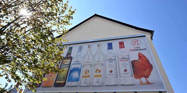 A banner with products from Nordbrand Nordhausen hangs in Germany. Authorities in the country want to put more restrictions on advertising alcohol, sports gambling, and tobacco.
