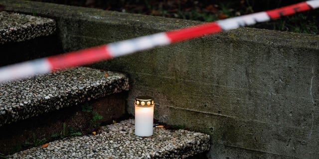 View of a funeral candle in front of the entrance to the Tecklenburger Land Vocational College. A 17-year-old student allegedly stabbed his teacher to death in Münsterland.