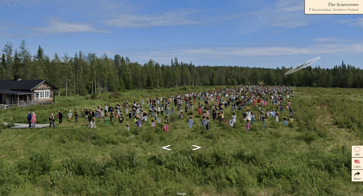 scarecrows in colorful clothes are seen across a grassy field in Finland.