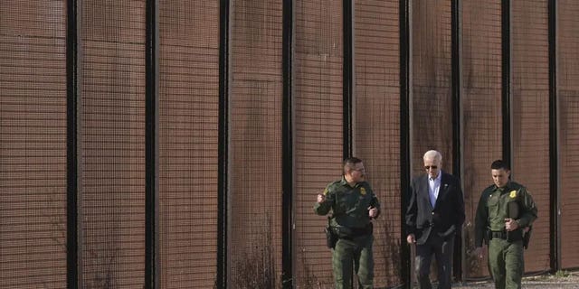President Joe Biden walks with U.S. Border Patrol agents along a stretch of the U.S.-Mexico border in El Paso Texas, Sunday, Jan. 8, 2023. 