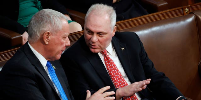 Rep. Steve Scalise, right, talks to Rep. Ken Buck in the House chamber on the second day of elections for speaker, Jan. 4, 2023, in Washington.