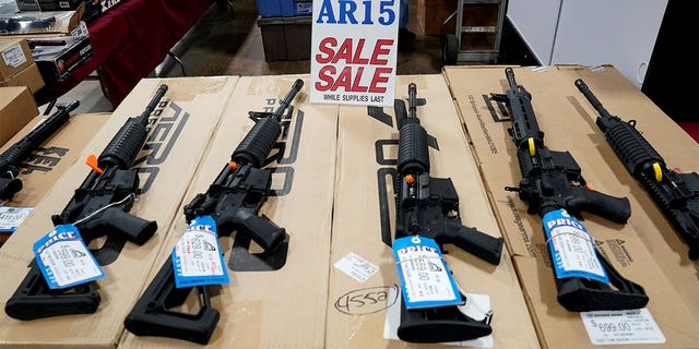 AR-15 rifles are displayed for sale at the Guntoberfest gun show in Oaks, Pennsylvania, on Oct. 6, 2017.