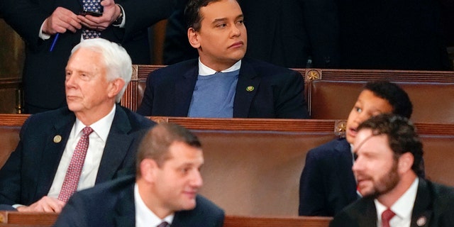 Rep.-elect George Santos, R-N.Y., top center, sits in the House chamber on the opening day of the 118th Congress at the U.S. Capitol, Tuesday, Jan. 3, 2023, in Washington.