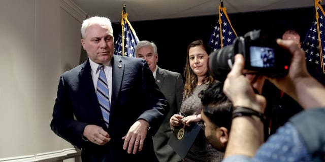 House Majority Leader Steve Scalise, left, departs after a press conference at the RNC headquarters on Capitol Hill on Jan. 25, 2023, in Washington, D.C.