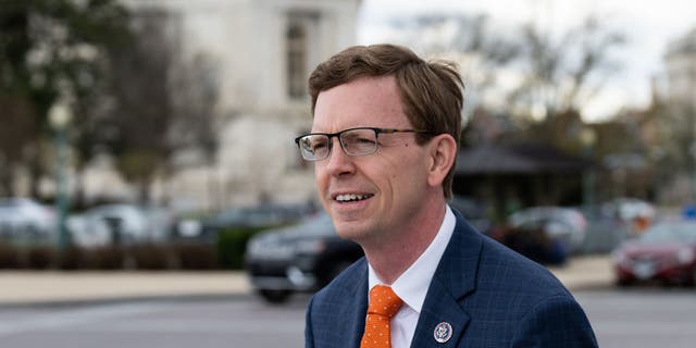 Rep. Dusty Johnson, R-S.Dak., walks to the Capitol for the last votes of the week on Friday, April 1, 2022. 