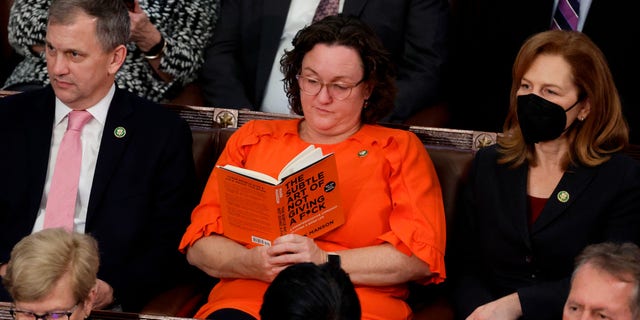 Rep. Katie Porter, D-Calif., reads a book in the House Chamber during the fourth day of elections for Speaker of the House at the U.S. Capitol Building on Jan. 6, 2023, in Washington, D.C. 