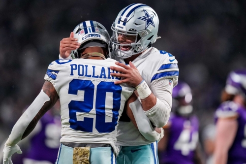 Dallas Cowboys quarterback Dak Prescott celebrates a touchdown with running back Tony Pollard in the third quarter against the Minnesota Vikings at US Bank Stadium. The Cowboys (7-3) demolished the previously Vikings (8-2) 40-3 on the road in an astonishing performance.