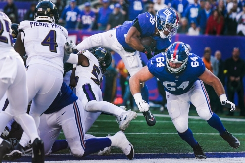 New York Giants running back Saquon Barkley dives into the endzone to score a touchdown during the second half against the Baltimore Ravens. The Giants continued their excellent start to the season with a 24-20 win over the Ravens, improving their record to 5-1.