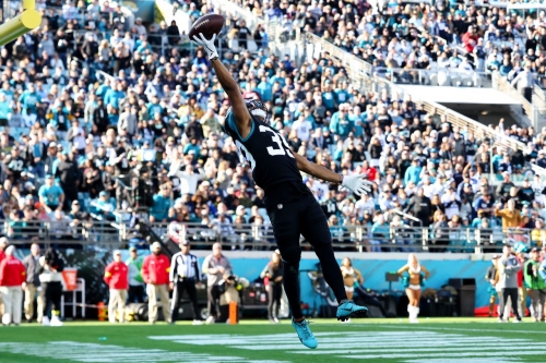 Jamal Agnew of the Jacksonville Jaguars attempts to catch a pass against the Dallas Cowboys during the second half. The Cowboys lost 40-34 in overtime after Rayshawn Jenkins' 52-yard interception was returned for a touchdown. 