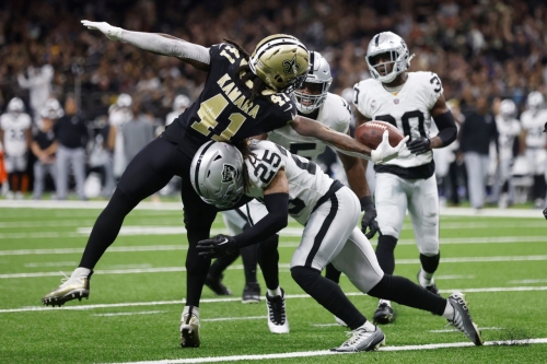 New Orleans Saints running back Alvin Kamara stretches across the goal line for a touchdown against the Las Vegas Raiders. The Saints shut out the Raiders, intercepting quarterback Derek Carr once, on the way to a 24-0 win. 