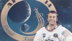 American astronaut Alan Bartlett Shepard Jr (1923 - 1998), Commander of NASA's upcoming Apollo 14 lunar landing mission, with the mission's insignia behind him at the Kennedy Space Center in Florida, 14th November 1970. (Photo by Space Frontiers/Getty Images)