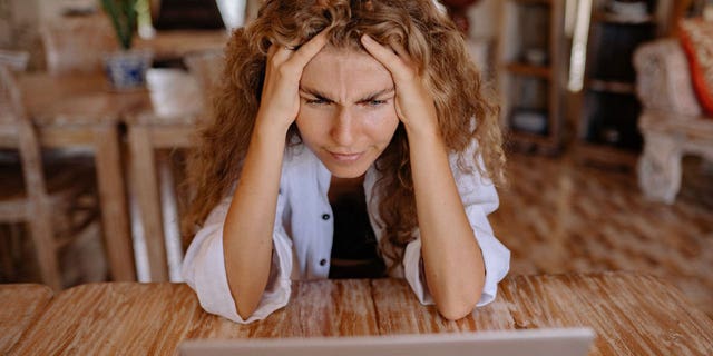 A woman presumably upset at the embarrassing auto-correct feature on her search engines.