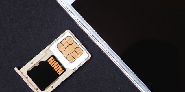 Photo of a SIM card in its case, outside the phone.