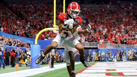 Adonai Mitchell of the Georgia Bulldogs catches a touchdown pass during the fourth quarter against the Ohio State Buckeyes.