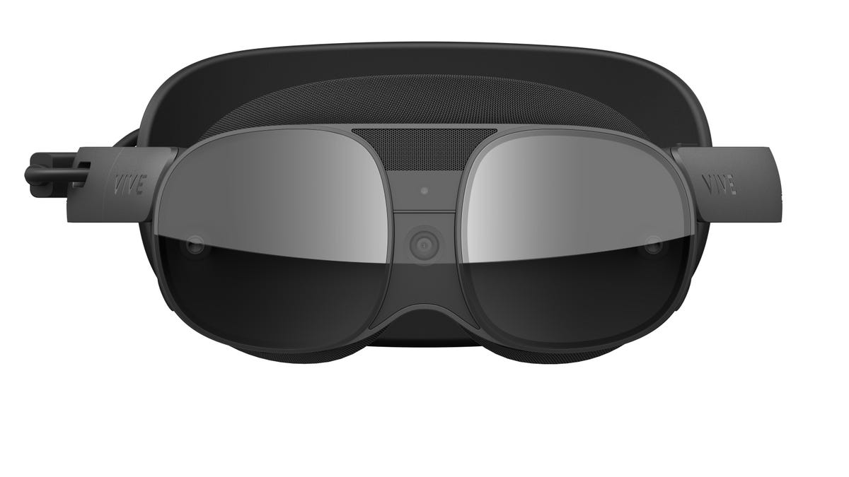 Vive XR Elite VR headset seen from the front. A black visor and a camera in the middle.