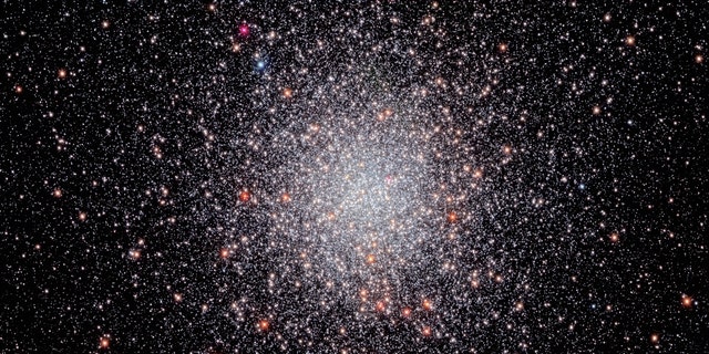 Looking like a glittering swarm of buzzing bees, the stars of globular cluster NGC 6440 shine brightly in this NASA Hubble Space Telescope image. The cluster is located some 28,000 light-years away in the constellation Sagittarius, the Archer.