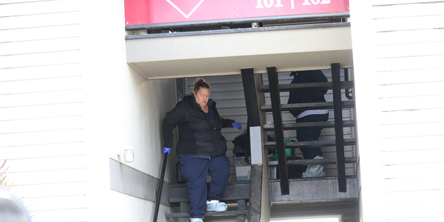 Crime scene tape surrounds an entrance to the Pullman apartment searched Friday morning.