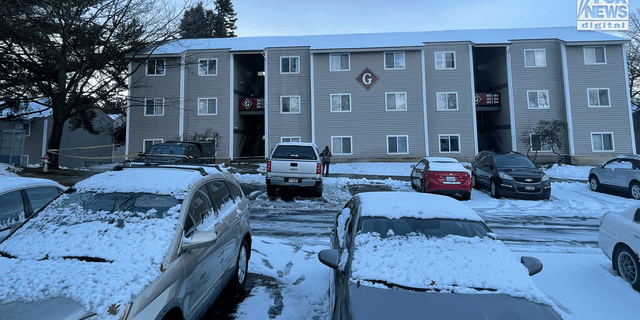 Crime scene tape surrounds an entrance to the Pullman, Washington, apartment searched Friday morning.