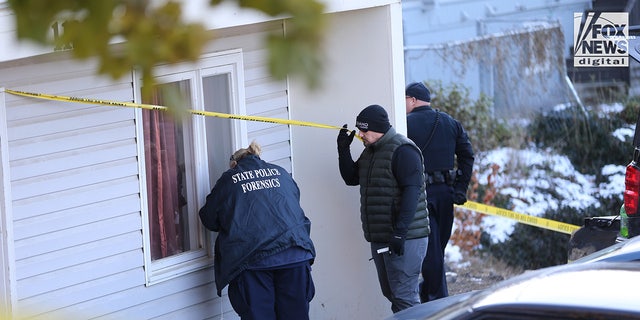 State police forensics personnel look for clues in Moscow, Idaho, on Nov. 21, 2022. Four University of Idaho students who were slain on Nov. 13 in this house.