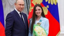 Russian President Vladimir Putin poses with figure skater Kamila Valieva during an awards ceremony for the Beijing 2022 Winter Olympic Games medal winners at the Kremlin in Moscow on April 26, 2022. (Photo by Mikhail KLIMENTYEV / SPUTNIK / AFP) (Photo by MIKHAIL KLIMENTYEV/SPUTNIK/AFP via Getty Images)