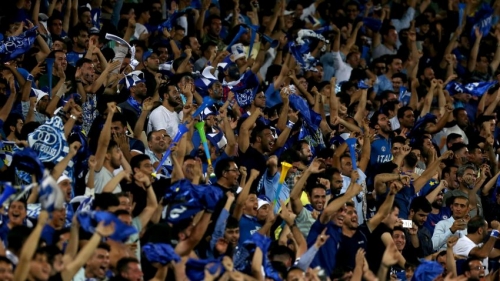 Iranian fans cheer for their team during the AFC Champions League football match Al-Sadd (Qatar) vs Esteghlal FC (Iran) at the Azadi stadium in Tehran on August 27, 2018. (Photo by ATTA KENARE / AFP)        (Photo credit should read ATTA KENARE/AFP/Getty Images)