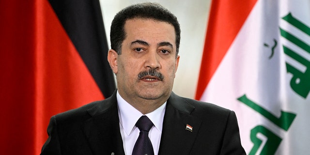 Iraq's Prime Minister Mohammed Shia al-Sudani and the German Chancellor (not in picture) give a joint press conference at the Chancellery in Berlin on January 13, 2023. 