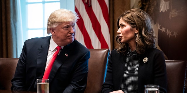 FILE - President Donald J. Trump speaks with South Dakota Gov.-elect Kristi Noem during a meeting with governors-elect in the Cabinet Room at White House on Thursday, Dec. 13, 2018, in Washington, D.C.