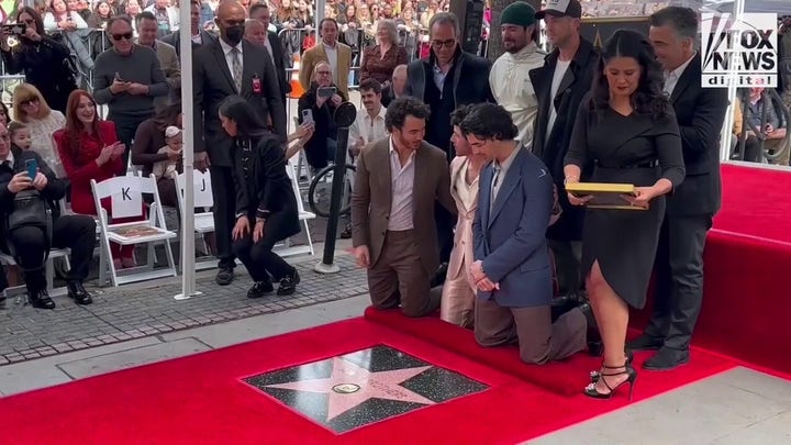 The Jonas Brothers see their star on the Hollywood Walk of Fame for the first time
