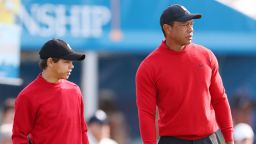 ORLANDO, FLORIDA - DECEMBER 18:  Charlie Woods and Tiger Woods of the United States looks on from the practice green during the final round of the PNC Championship at Ritz-Carlton Golf Club on December 18, 2022 in Orlando, Florida. (Photo by Mike Ehrmann/Getty Images)