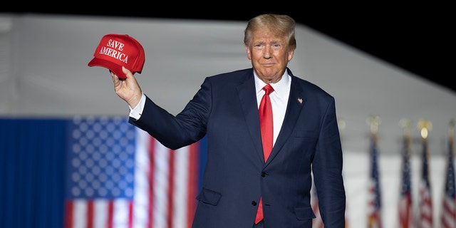 Former President Donald Trump makes his entrance at a rally at the Minden Tahoe Airport in Minden, Nev.,  Oct. 8, 2022. Trump angrily lashed out Wednesday, Oct. 12, calling the nation's legal system a "broken disgrace" after a judge ruled he must answer questions under oath next week in a defamation lawsuit lodged by a writer who says he raped her in the mid-1990s. 