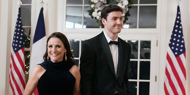 Actress Julia Louis-Dreyfus and her son Charlie Hall arrive for the White House state dinner in Dec. 2022.