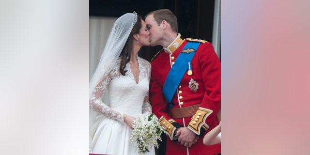 Catherine, Duchess of Cambridge and Prince William, Duke of Cambridge on the balcony at Buckingham Palace, following their wedding at Westminster Abbey on April 29, 2011, in London.