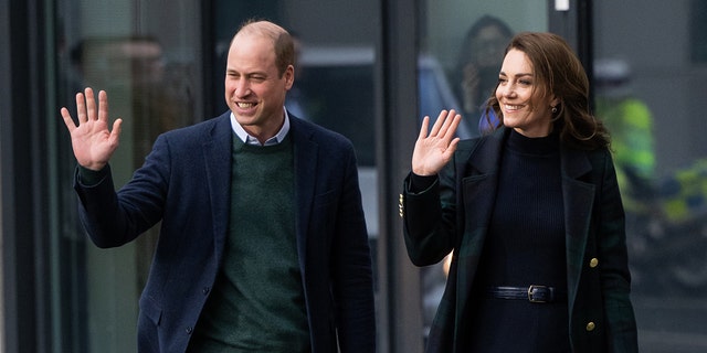 Prince William and Princess Kate wave to fans outside Royal Liverpool University Hospital.