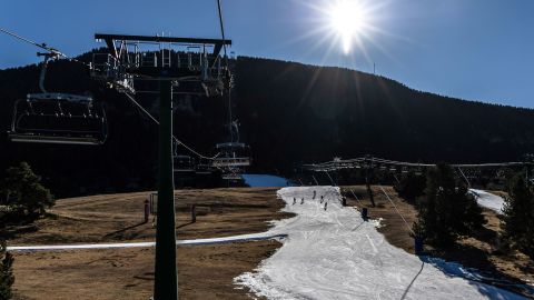 Dry ground surrounds a narrowed ski run at La Molina ski resort in Girona, Spain, on Thursday, Jan. 5, 2023. 