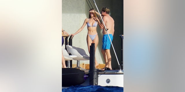 Leonardo DiCaprio enjoyed a swim after chatting with multiple women aboard the yacht.