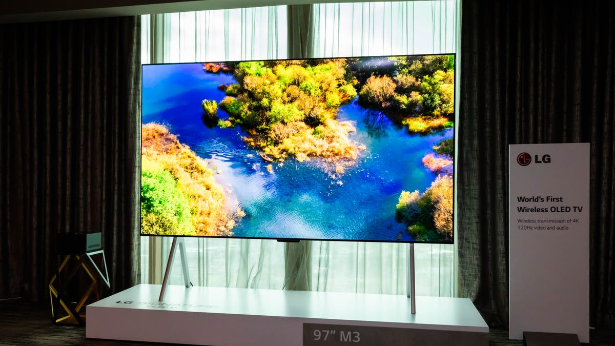 LG's 97-inch wireless M3 OLED TV on a stand.