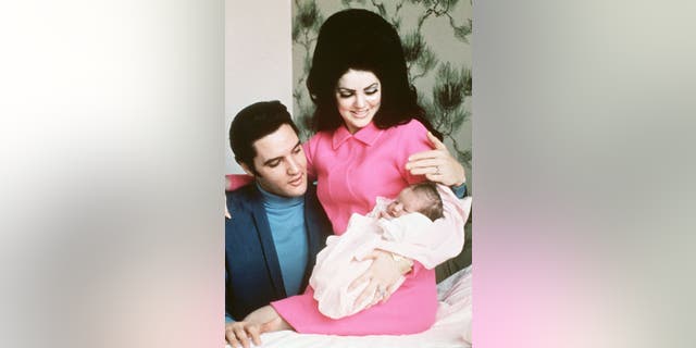 Elvis Presley and his wife, Priscilla, prepare to leave the hospital with their new daughter, Lisa Marie in Memphis, Tennessee, February 5, 1968.