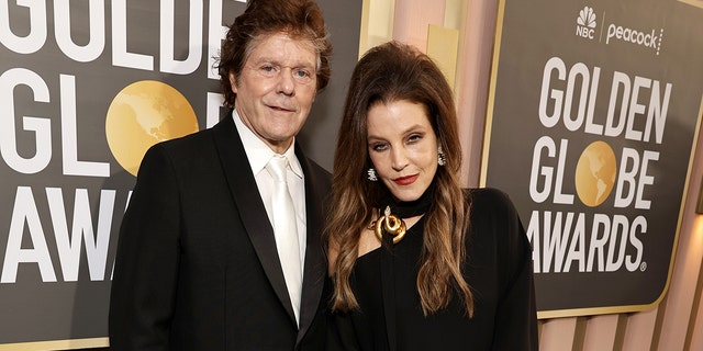 Jerry Schilling, left, and Lisa Marie Presley arrive at the 80th Annual Golden Globe Awards held at the Beverly Hilton Hotel on Jan. 10, 2023 in Beverly Hills, California. 