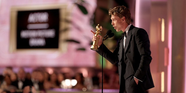 Austin Butler accepts the Best Actor in a Motion Picture – Drama award for "Elvis" onstage at the 80th Annual Golden Globe Awards held at the Beverly Hilton Hotel on Jan. 10, 2023 in Beverly Hills, California. 