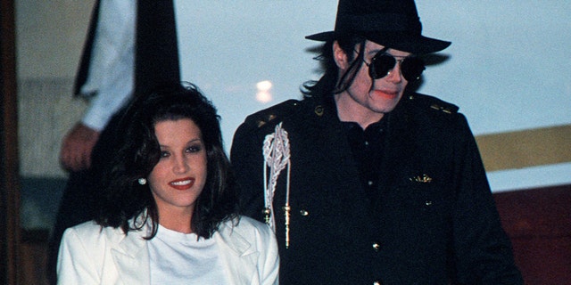 This August 16, 1994 file photo shows US pop star Michael Jackson and his then wife Lisa-Marie Presley arriving at the airport in Budapest.