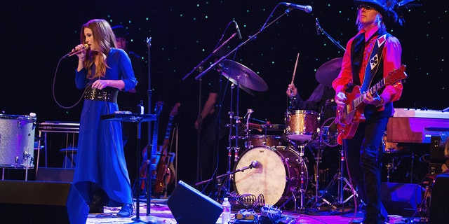 Lisa Marie Presley and performs on stage with husband and guitarist Michael Lockwood at the Triple Door Theater on August 28, 2013 in Seattle, Washington. 