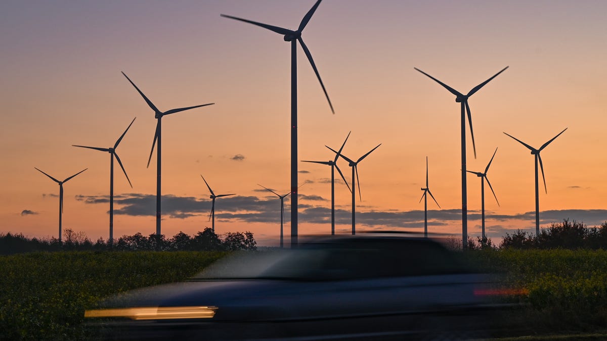 A field of wind turbines at dusk