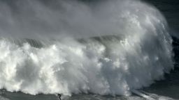 TOPSHOT - Portuguese surfer Hugo Vau rides a wave during the big waves Nazare Tow Surfing Challenge in Nazare, on February 11, 2020. (Photo by MIGUEL RIOPA / AFP) (Photo by MIGUEL RIOPA/AFP via Getty Images)