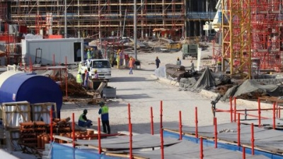 Migrant laborers work at a construction site at the Aspire Zone in Doha on March 26, 2016. 