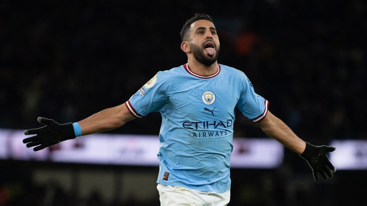 Manchester City attacker Riyad Mahrez celebrates scoring a goal.