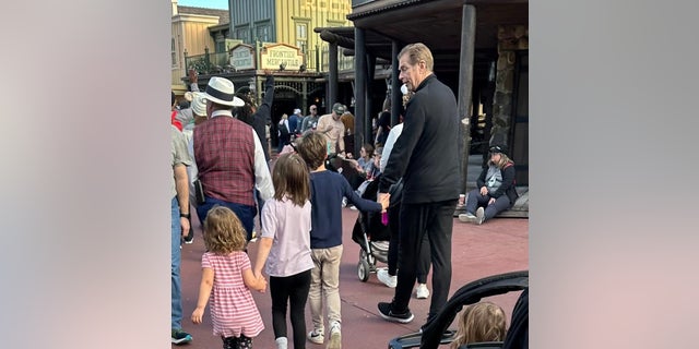 Marie Osmond shared a photograph of Steve Craig walking hand in hand with their grandchildren at Disney World.