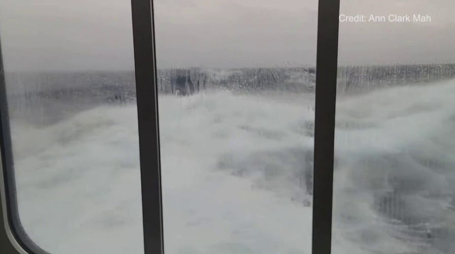 Large waves buffet Antarctica cruise ship in Drake Passage