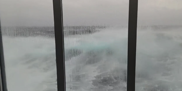 Waves are seen crashing alongside the Viking Polaris cruise ship during its recent voyage in the Drake Passage.